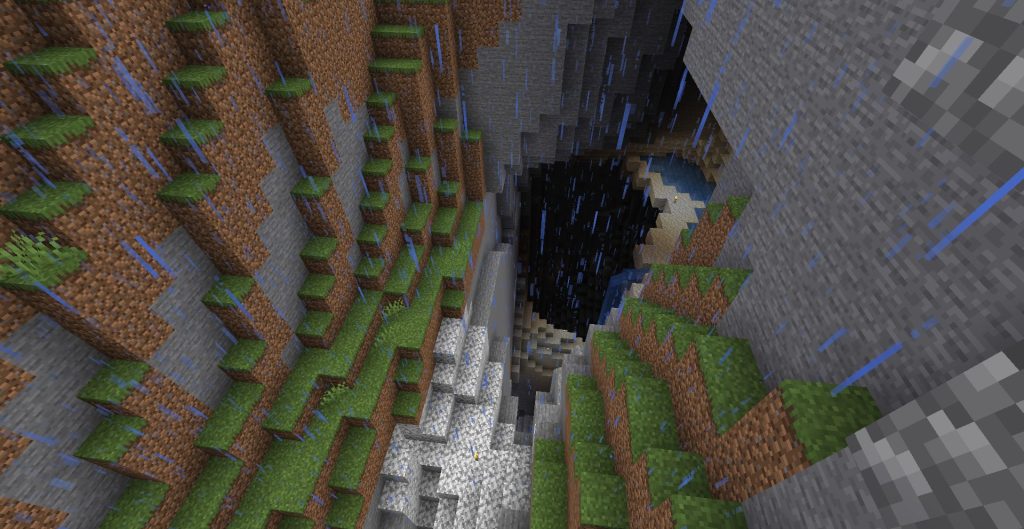 雪山の下に続く洞窟